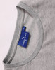 A grey ladies' long sleeve cotton tee shirt featuring a crew neck and a tag with branding.