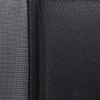 A close-up of textured fabric in dark grey and black, showcasing a layered design.