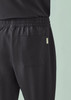 A pair of black unisex scrub pants featuring a comfortable waistband and a back pocket.