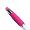A ballpoint pen with a pink rubber grip and a shiny silver clip at the top, featuring a white barrel.