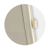 A light beige notebook with a textured cover and a strap closure. It features a logo on the cover.