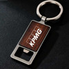 A drink bottle opener keyring featuring a square wooden design and a silver metal keyring, with a logo.