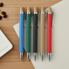 Five pens in various colours: blue, green, black, tan, and red, with wooden accents and silver clips, displayed on a wooden surface.
