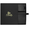 A black travel gift set featuring leather passport holder and luggage tag, presented in a sleek box with a logo.