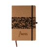 A cork notebook featuring a coffee grounds design band, with a black elastic closure and a ribbon marker.