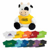 A cow plush toy featuring black and white markings, wearing a yellow shirt with a logo. Various coloured shirts displayed below.