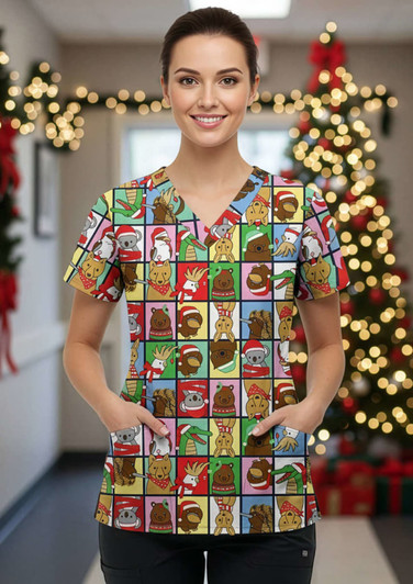 A women's Christmas scrub top featuring a vibrant pattern of festive animals and holiday designs in various colours.
