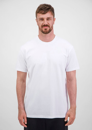 A man wearing a plain white short sleeve tee, standing against a neutral background. The tee features a logo.