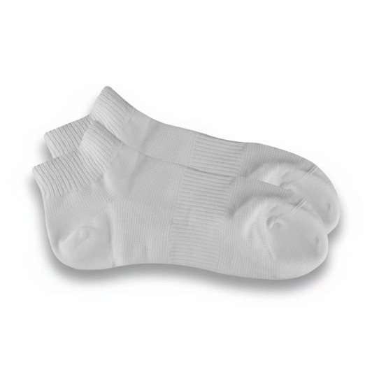 A pair of white ankle grip socks with textured panels for improved traction and comfort.