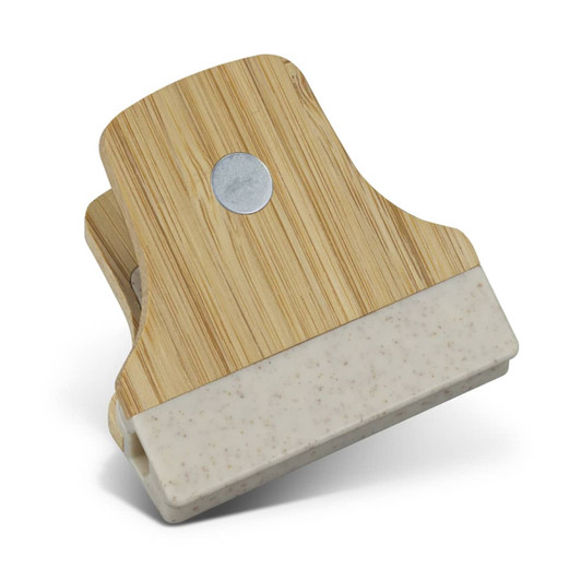 A bamboo clip featuring a natural wood finish with a white base, showcasing a round metal accent.