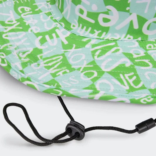 A green wide brim hat featuring a patterned design and an adjustable strap. The hat includes a logo.