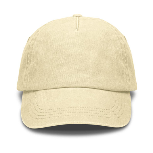 A vintage washed cap in a soft cream colour with a curved brim. It features a logo on the front.