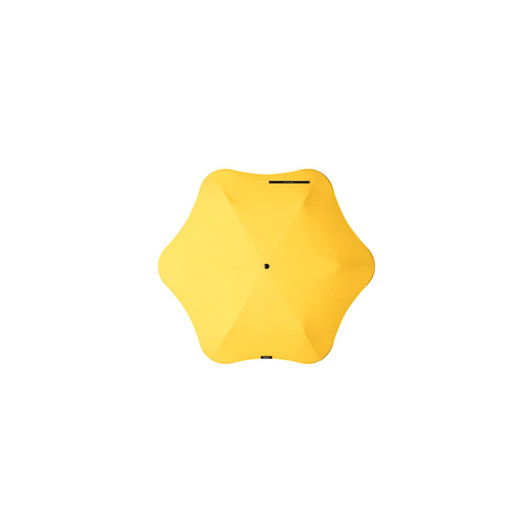 A yellow BLUNT Neo Umbrella with a unique star-shaped design and a central black button.