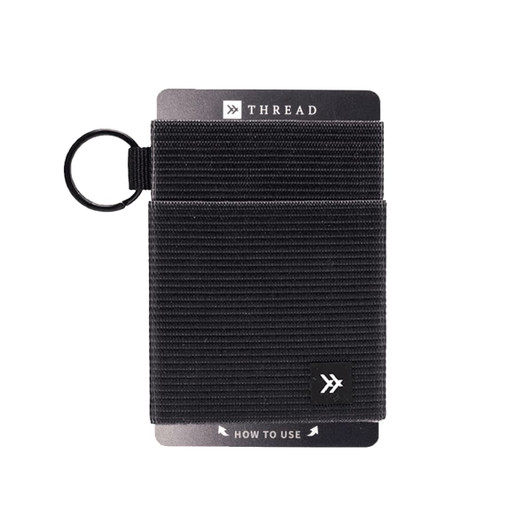 A black Thread Elastic Wallet features a textured design and includes a keyring attachment. It has a branding logo.