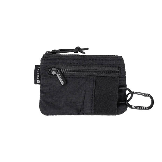 A black pouch wallet featuring a zipper pocket, a Velcro section, and a carabiner clip. It has a logo detail.
