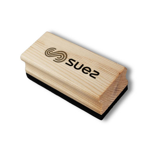 A wooden whiteboard eraser with a smooth wooden top and a black felt bottom. It features a logo.