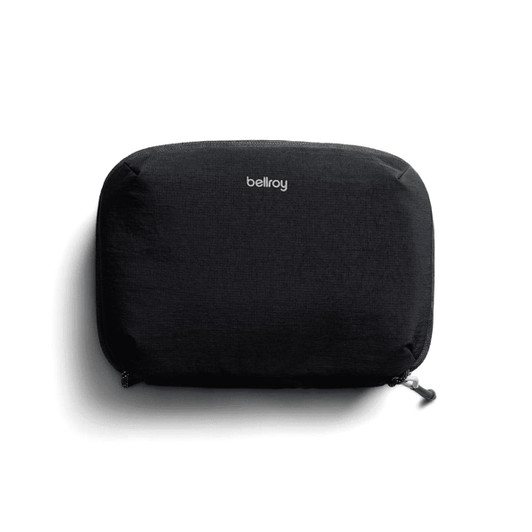 A black tech kit with a zip closure and a logo on the front, featuring a sleek, minimalist design.