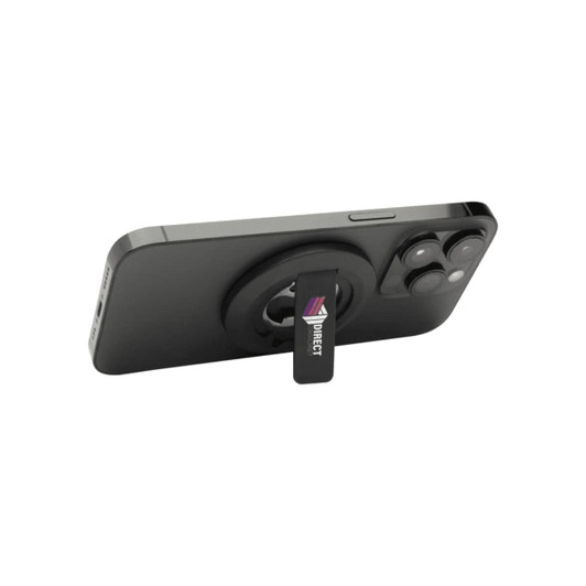 A magnetic phone stand in black, featuring a bottle opener and a logo, mounted on the back of a smartphone.