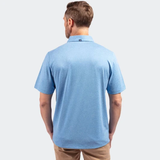 A men's polo shirt in light blue, featuring a collar and short sleeves, viewed from the back. It has a branding logo.