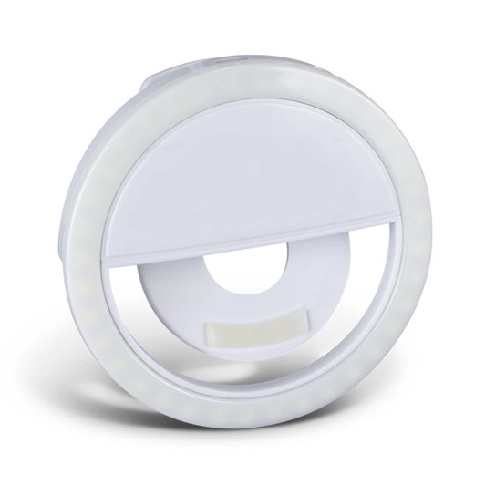 A circular white selfie phone light featuring an integrated stand and LED lights around the edge.