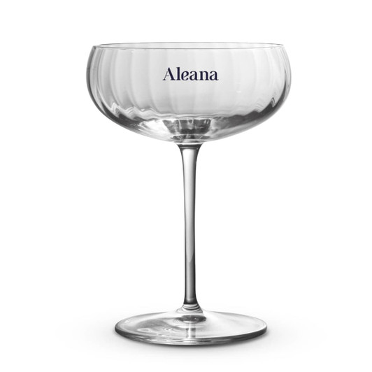A clear glass cocktail glass with a wide bowl and slender stem, featuring a logo on the side.