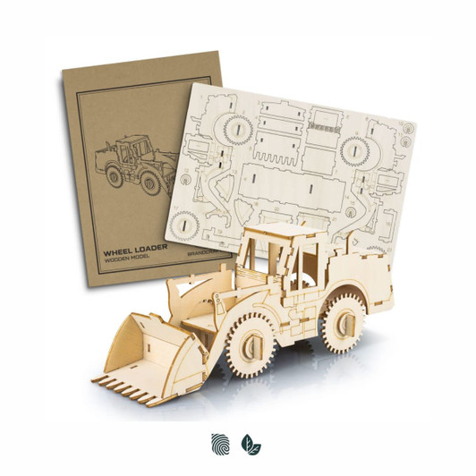 A wooden model of a wheel loader in natural wood finish, alongside its flat packing template.