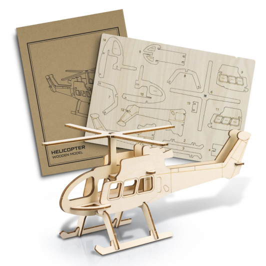 A wooden helicopter model kit in natural colour with assembly instructions on a panel behind it.