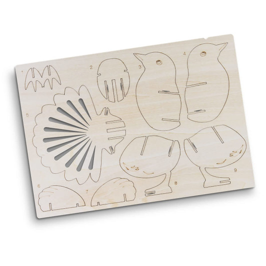 A wooden model kit featuring shaped cutouts, including animals and shell designs, in a light wood finish.