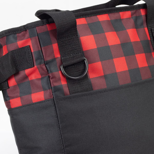 A cooler bag featuring a red and black checkered pattern with black sides and sturdy straps. It has a branding logo.