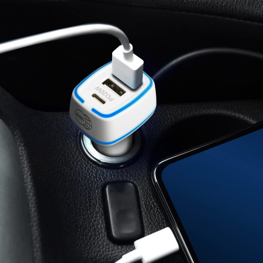 A USB car charger in white and blue plugged into a vehicle's power socket, with a charging cable connected to a phone.