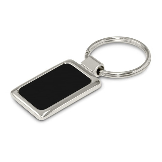 A rectangular metal key ring with a shiny silver finish and a black etched surface, featuring a logo.