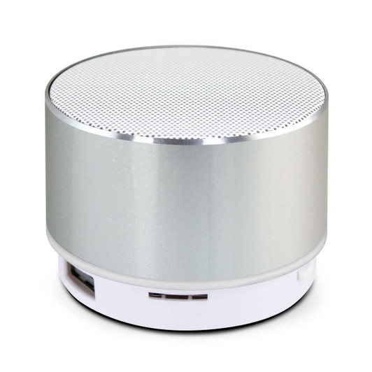A silver Bluetooth speaker with a textured top and a white base, featuring a subtle logo.