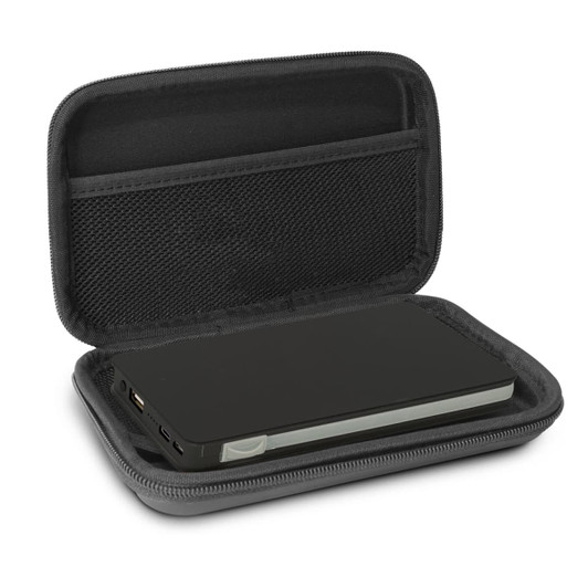 A green wireless charging power bank inside a black case, featuring a mesh pocket and zippers.