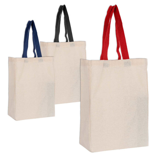 Three Calico trade show bags in cream, featuring red, black, and blue handles. Each bag has a logo or branding.