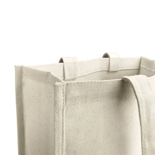A beige tote bag made of canvas with sturdy handles and a textured finish, featuring a logo.