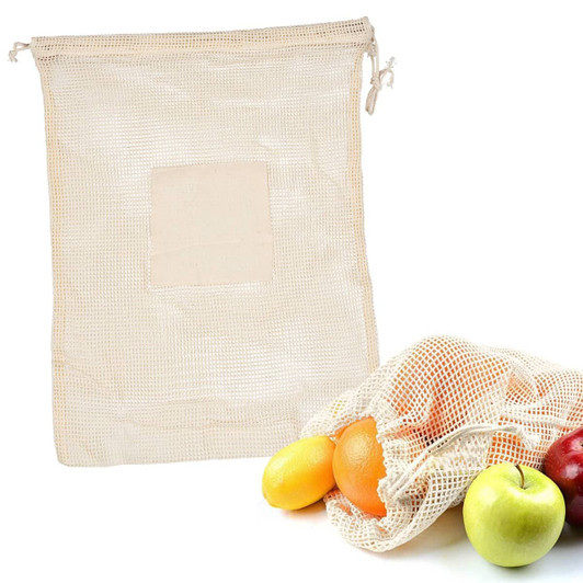 A cream-coloured mesh produce bag displayed alongside various fruits, including apples and oranges. It features a logo.