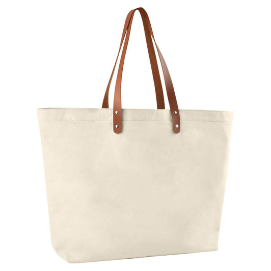 A cotton tote bag in cream with brown leather handles. It features a logo on one side.