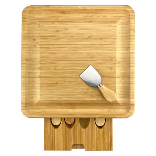 A bamboo cheeseboard with a wooden handled knife and a holder for additional utensils. It has a natural finish.