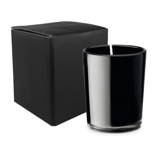 A black glass candle beside a black box. The candle features a simple, elegant design.