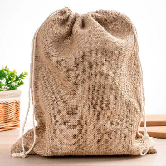 A natural beige jute bag with a drawstring closure, featuring a simple design and a logo.