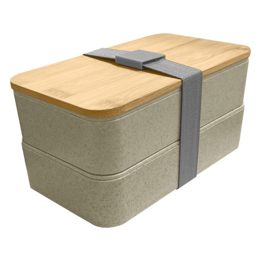A wheat straw lunch box pack in light grey with a bamboo lid, secured by a grey strap, featuring a two-tier design.