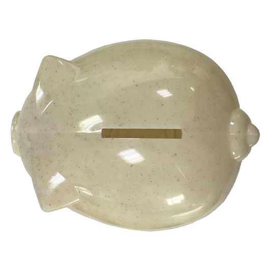 A light beige piggy bank with a slot on top and a rounded body, made from wheat straw material.