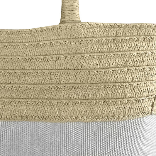 A patterned tote bag in light beige and white, featuring woven textures and a branded logo.