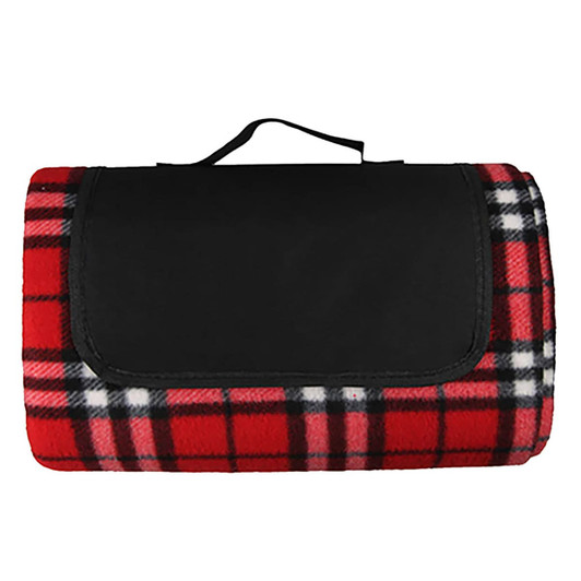 A red and black plaid picnic blanket with a black carrying strap and a solid black flap. It has a logo.
