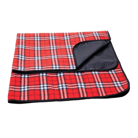 A red and black check picnic blanket with a waterproof backing, folded neatly. It features a logo in one corner.