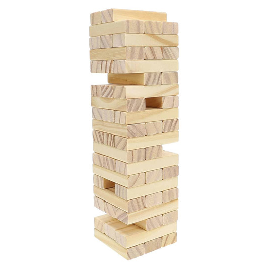 A large Jenga set made of light wood blocks, stacked vertically in a tower formation.