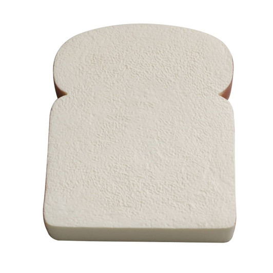A stress-shaped product resembling a slice of bread in light beige with a textured surface and rounded edges.