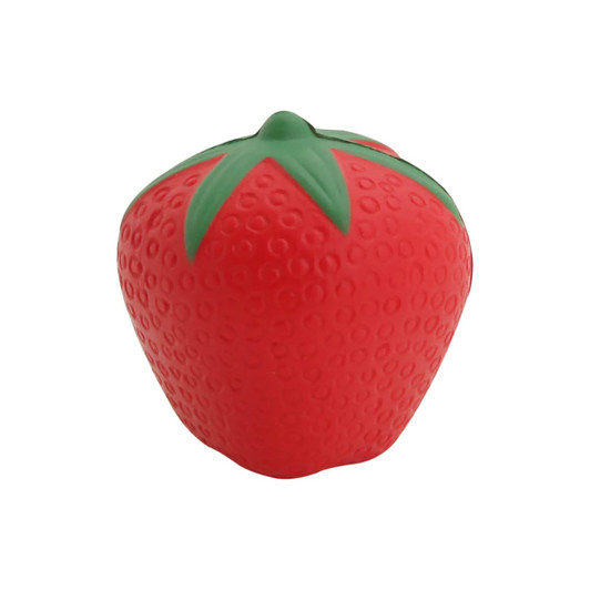 A red rubber stress ball in the shape of a strawberry with green leaf details. It has a smooth texture and rounded form.
