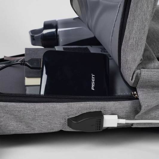 A grey Techpac Laptop Backpack with a drink bottle, power bank, notebook, and charging cable visible inside.