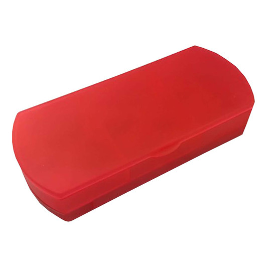 A red travel pill box with a hinged lid, designed for storing medication securely. It has a smooth surface and a compact shape.
